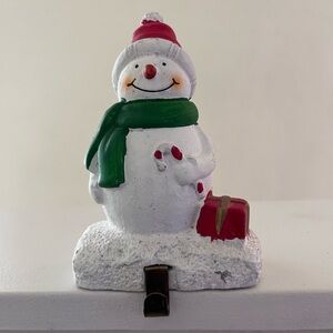 Festive Snowman Stocking Holder with Red and Green Accents
